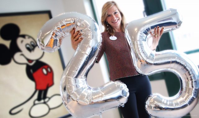 Disneyland Paris 25th Anniversary: resort présidente Catherine Powell holds silver 25 balloons